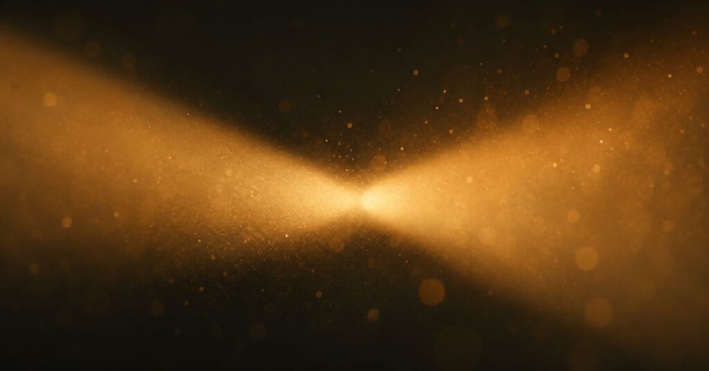 Two beams of amber light merging in darkness, imagery for a lucky to have found you poem by Joshua Cintron.